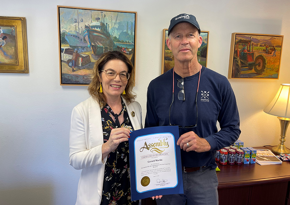 Asm. Dawn Addis presents a certificate of recognition to Gerard Martin