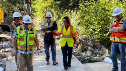 Asm. Addis with Caltrans construction crew, touring the Big Sur log jam