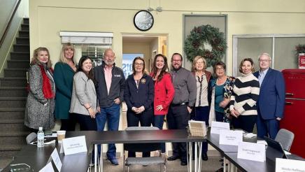 Asm. Addis posing with group at SLO Realtors Association