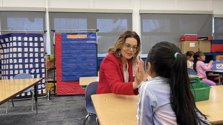 Asm. Addis giving high-five to student while visiting the brand new campus of the Dual Language Academy of the Monterey Peninsula