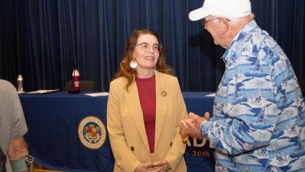 Asm. Addis speaking with attendee
