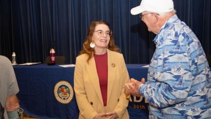 Asm. Addis speaking with attendee
