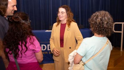Asm. Addis speaking with attendees