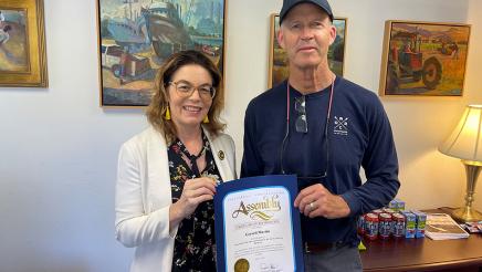 Asm. Addis presents a certificate of recognition to Gerard Martin for his years of mentorship and contribution to the Arts Council of Monterey