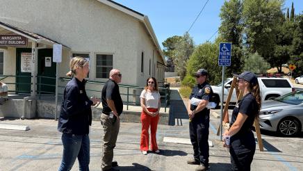 Asm. Addis and staffer speaking with CAL FIRE representatives