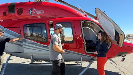 Asm. Addis speaking with helicopter operator